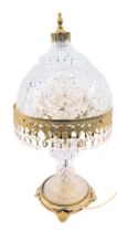 A 19thC brass and pressed glass table lamp, the domed shade of cross hatch decoration with two tier