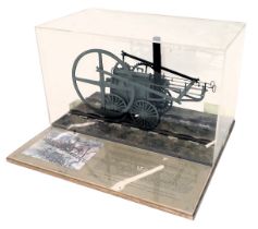 A scale model of Richard Trevithick's Tramroad locomotive, scale 1cm:12cm, seated on a track with in