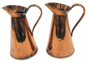 Two 19thC copper jugs, 27cm high. (2)