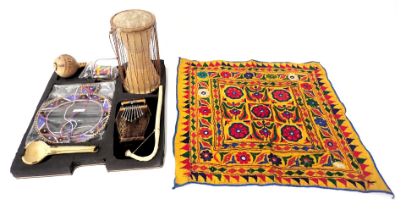 A quantity of African artefacts, to include a Masai beaded collar, a Marimba textile hanging, musica