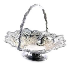 A silver plated centre basket, with pierced rococo scroll decoration and swing handle, 28cm high, 32