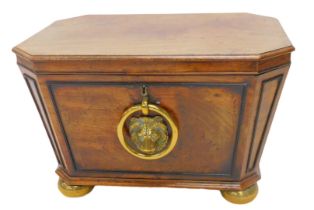 A George IV mahogany cellarette, the rectangular hinged top with canted corners, enclosing a lead li