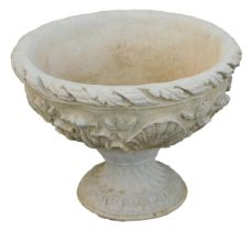 A reconstituted stone acanthus leaf garden urn, with a fluted border and shell Neoclassical scroll d