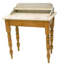 A pine washstand, with a white marble top on turned legs, 80cm wide.