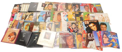 A group of Elvis records and ephemera, to include Elvis calendars, Elvis 45s, to include Where No On