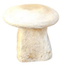 A reconstituted stone saddle stone, 36cm high.