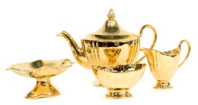 A Royal Winton gold lustre finish part service, comprising tea pot, milk jug, sugar bowl, and bon bo