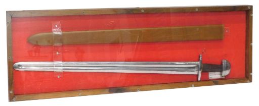 A replica Viking sword and scabbard, in perspex and pine case, 105cm x 35cm.
