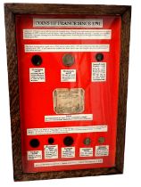 A display case showing the coins of France in 1791, (coins AF), in oak and perspex case, 47cm x 32cm