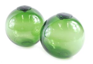 Two glass fishing floats, 14cm high.