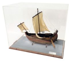 A scale model of a Roman merchant ship, with single mast, swan carved figure head, in perspex case,