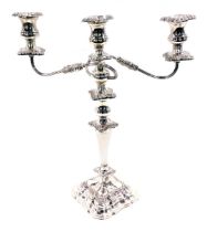 A Sheffield plate three branch candelabrum, on stepped foot with scroll detail.