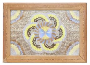 A hardwood table top, inset with a geometric design of butterflies, lacking feet, 70cm high, 50cm wi