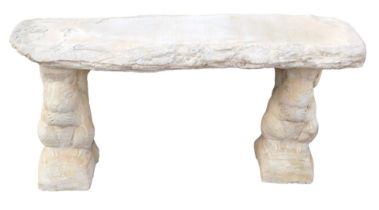 A reconstituted stone garden seat, formed on squirrel plinths with a straight timber seat, 46cm high