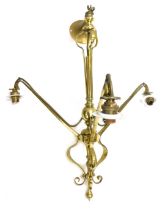 An early 20thC Art Nouveau brass three branch chandelier, with white finish shades, 58cm high.