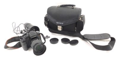 A Sony Alpha digital camera, with a DT 3.5-5.6 macron lens, and a Sony SH0007 lens, in material carr