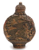 A 20thC Chinese bronzed metal snuff bottle, embossed to the obverse with a lady with a fan in a gard