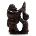 A contemporary Japanese style hardwood netsuke, carved as a father and son holding a noh mask, 4.5c
