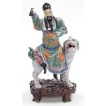 A 19thC Qing dynasty famille verte porcelain figure group, modelled as the Immortal Fuxing seated up