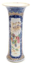 A Qianlong famille rose porcelain vase, of sleeve form, decorated with reserve panels of figures in