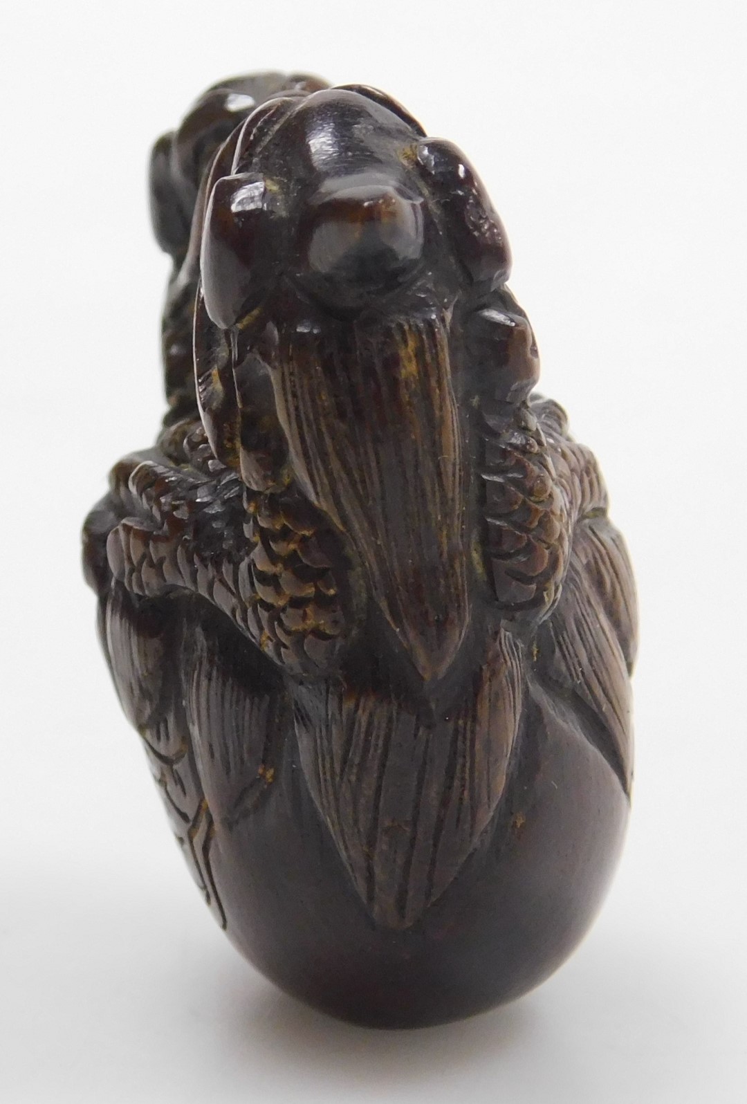 A contemporary Japanese style hardwood netsuke, carved as two dragons embraced over a bell signed, 4 - Image 4 of 6