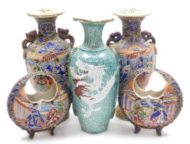 A pair of early 20thC Satsuma basket vases, of moon shaped form, decorated in moriage (raised enamel