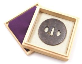 An Edo period iron tsuba, of marugata shape, with an engraved repeating geometric design, by Okamoto