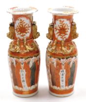 A pair of Chinese porcelain vases decorated in the Kutani style, of twin handled, shouldered taperin