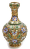 A 20thC Chinese champleve enamel vase, of bottle neck form, decorated with lotus flowers and scrolli