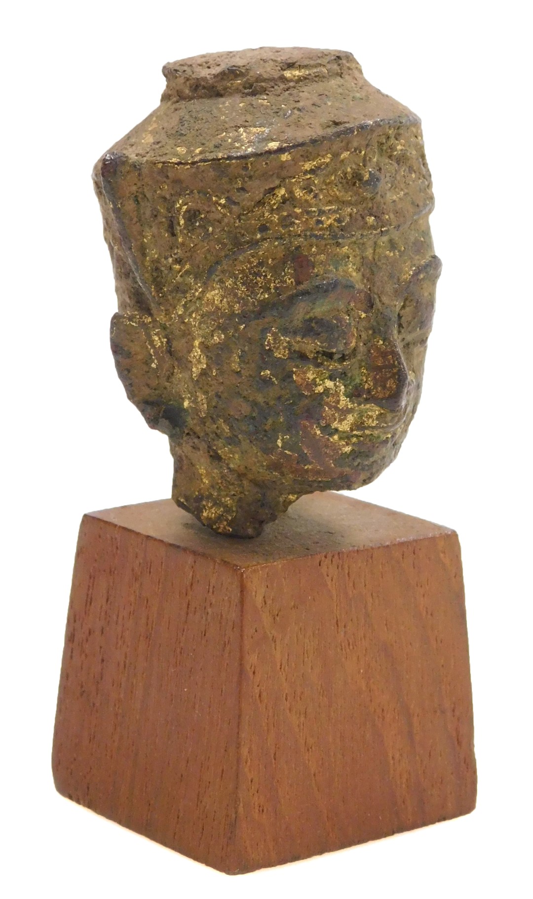 A Thai gilt bronze Ayutthaya Buddha head, possibly 17thC, with good patination, on a wooden stand, 7