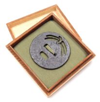 An iron tsuba, late Nanbokucho or early Muromachi period, with dragonfly sukashi, 7cm wide.