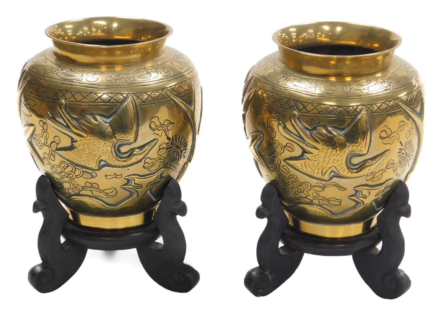 A pair of early 20thC Chinese heavy brass vases, embossed with a deer, bamboo, trees and a crane, th