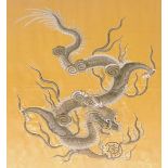 A late 19thC Chinese stump work embroidery, on gold silk, of a four claw dragon, in white and silver