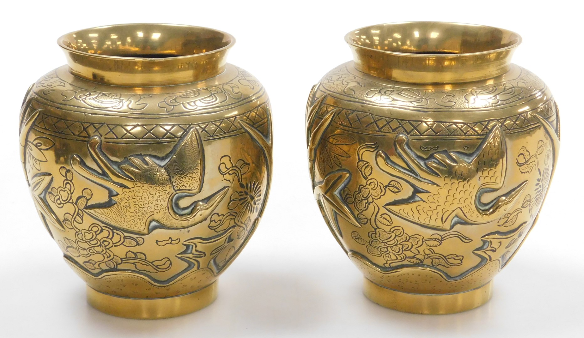 A pair of early 20thC Chinese heavy brass vases, embossed with a deer, bamboo, trees and a crane, th - Image 2 of 9