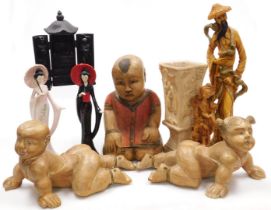 A group of carved hardwood, ceramic and resin figures, together with a resin vase and a shrine. (a