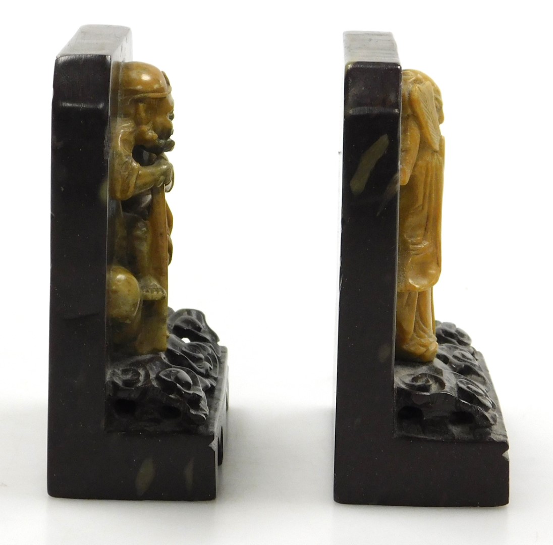 A pair of late 19thC Qing dynasty soapstone bookends, carved with immortals on a cloud ground, and c - Image 5 of 6