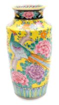 A 20thC famille jaune porcelain vase, decorated with an exotic bird and flowers, 24cm high.