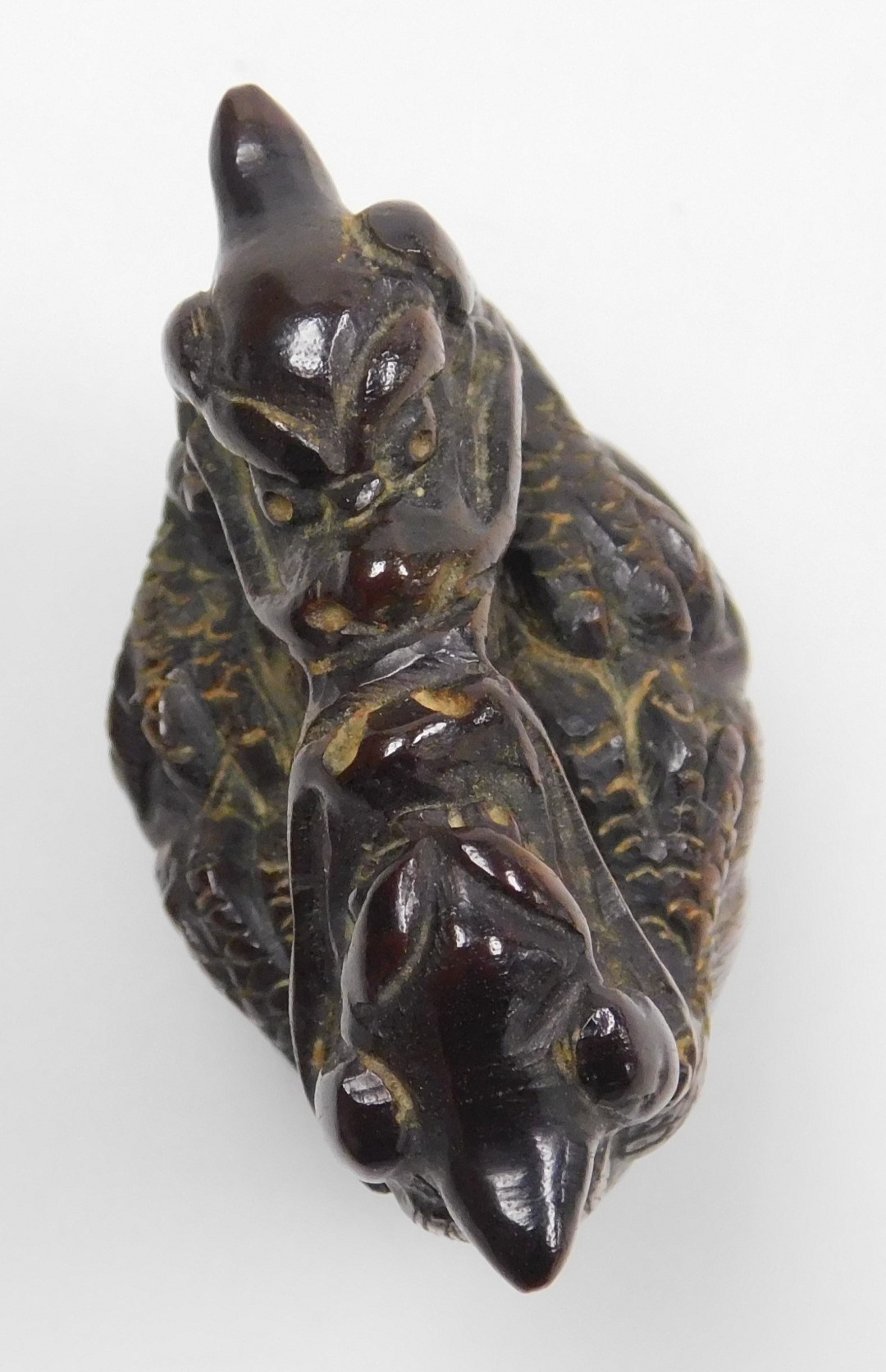 A contemporary Japanese style hardwood netsuke, carved as two dragons embraced over a bell signed, 4 - Image 5 of 6