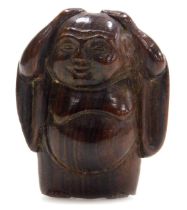 A contemporary Japanese style hardwood netsuke carved as Buddha, in standing pose, with his hands up