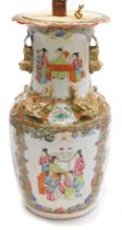 A 19thC Qing dynasty Cantonese famille rose porcelain vase, moulded with dragons and dogs of fo, in