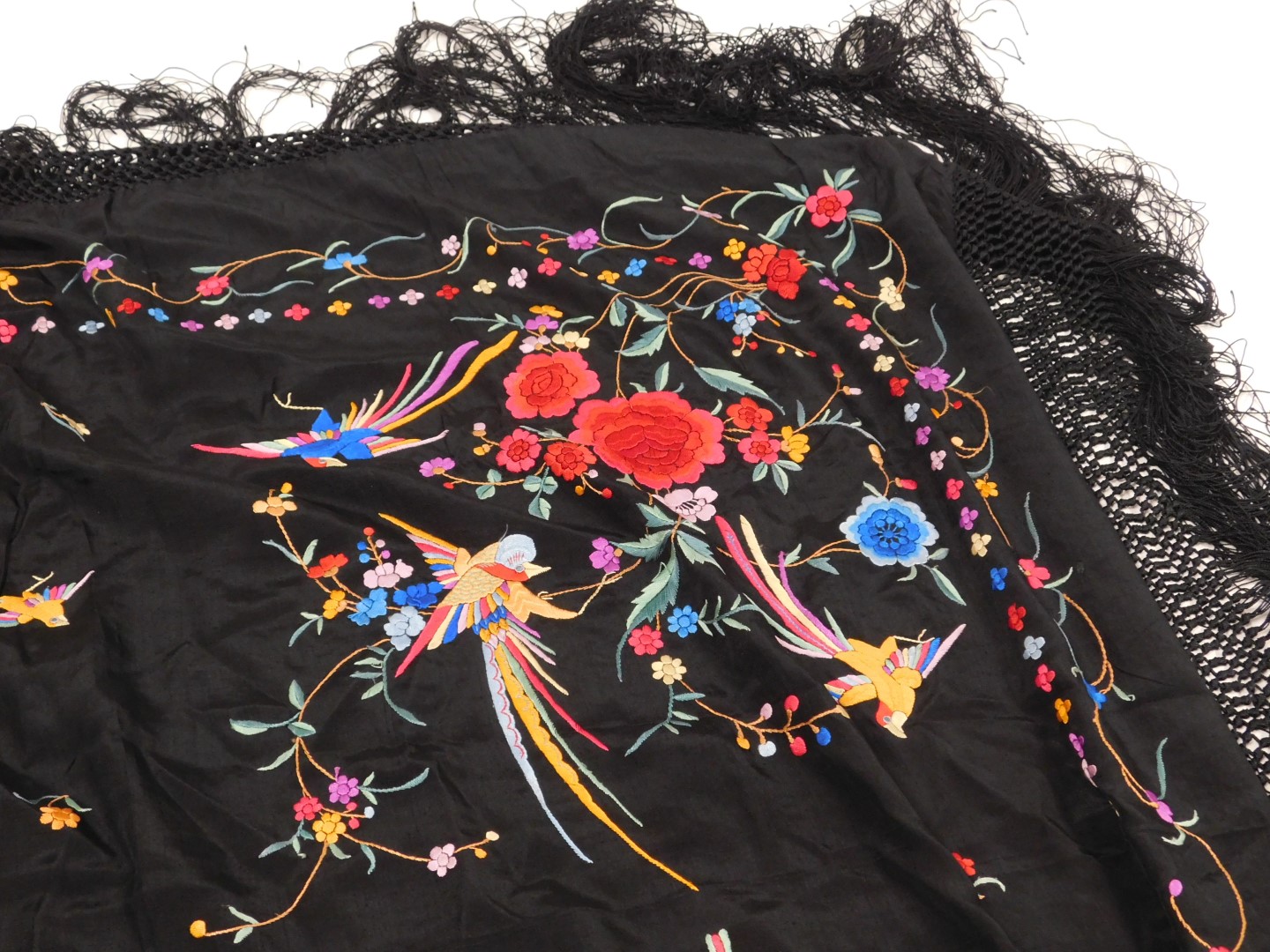A 20thC Chinese black silk shawl, embroidered with exotic birds, and flowers, with a tassel fringe, - Image 2 of 4