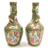 A pair of early 19thC Qing dynasty Cantonese famille rose porcelain vases, of long necked, ovoid for