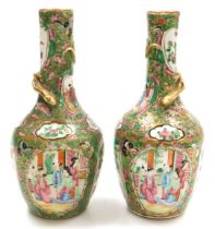 A pair of early 19thC Qing dynasty Cantonese famille rose porcelain vases, of long necked, ovoid for