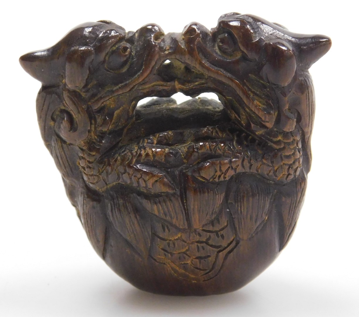 A contemporary Japanese style hardwood netsuke, carved as two dragons embraced over a bell signed, 4 - Image 3 of 6