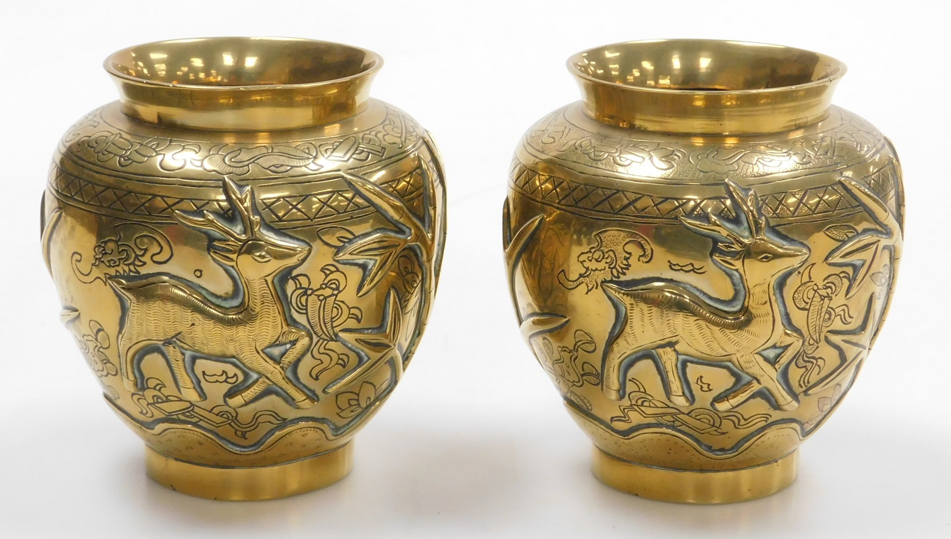 A pair of early 20thC Chinese heavy brass vases, embossed with a deer, bamboo, trees and a crane, th - Image 4 of 9