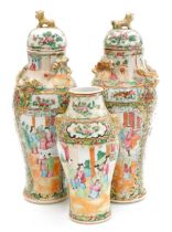 A pair of 19thC Qing dynasty Cantonese famille rose porcelain vases and covers, of baluster form, mo