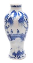A Qing dynasty blue and white porcelain vase, Kangxi marks but later, of baluster form, decorated wi