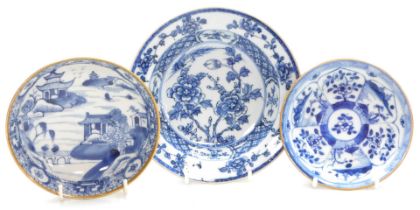 A Qianlong blue and white porcelain dish, decorated with peonies, within a hatched and floral border