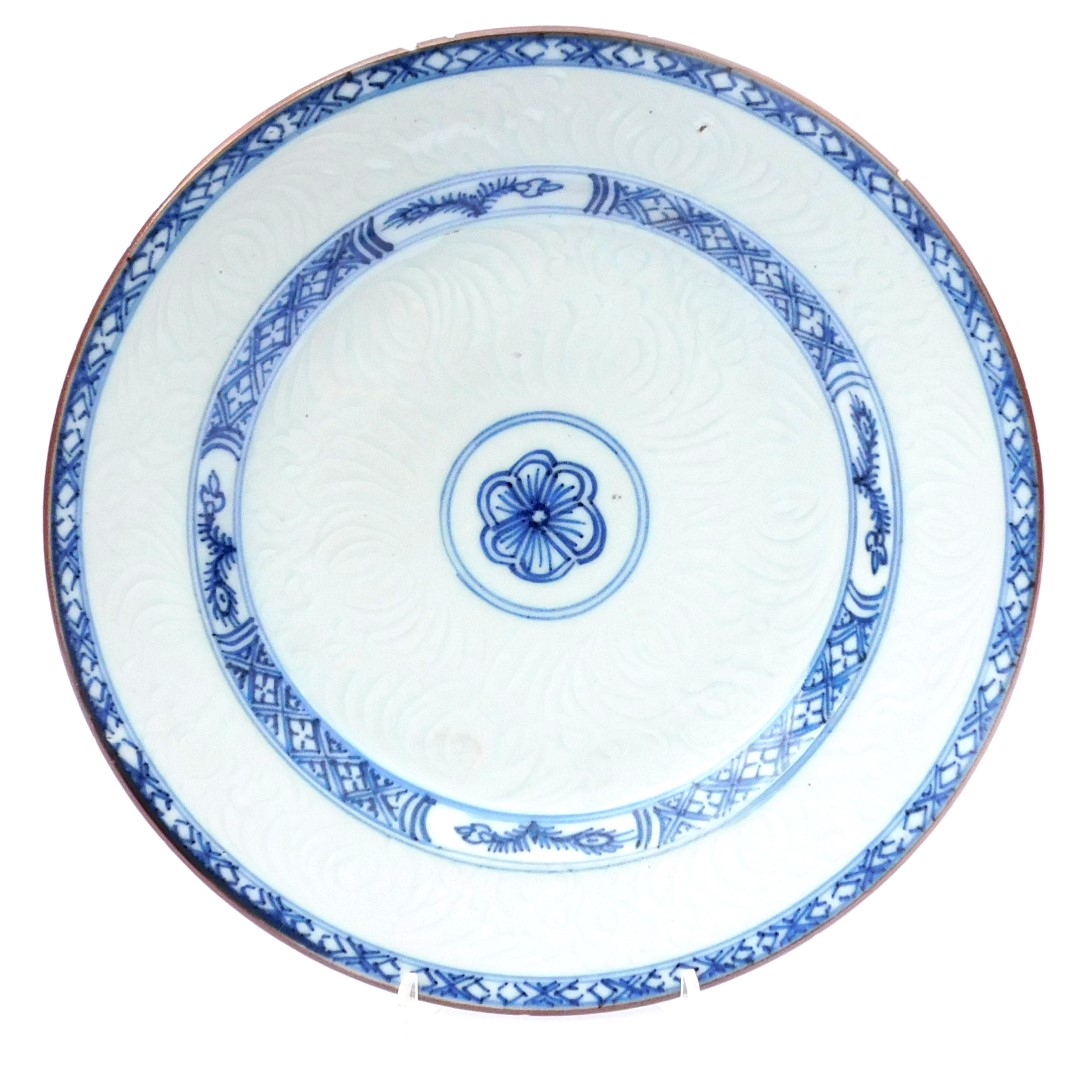 An 18thC Qing dynasty blue and white plate, an hua decorated with stylised flowers, within hatched b