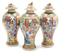 Three 19thC Qing dynasty Cantonese famille rose porcelain vases and covers, of baluster form, reserv